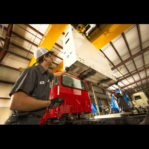 Techs installing CNG fuel system