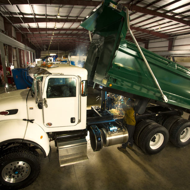 Truck with green dump truck body