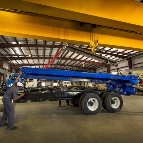 Tech installing component on truck